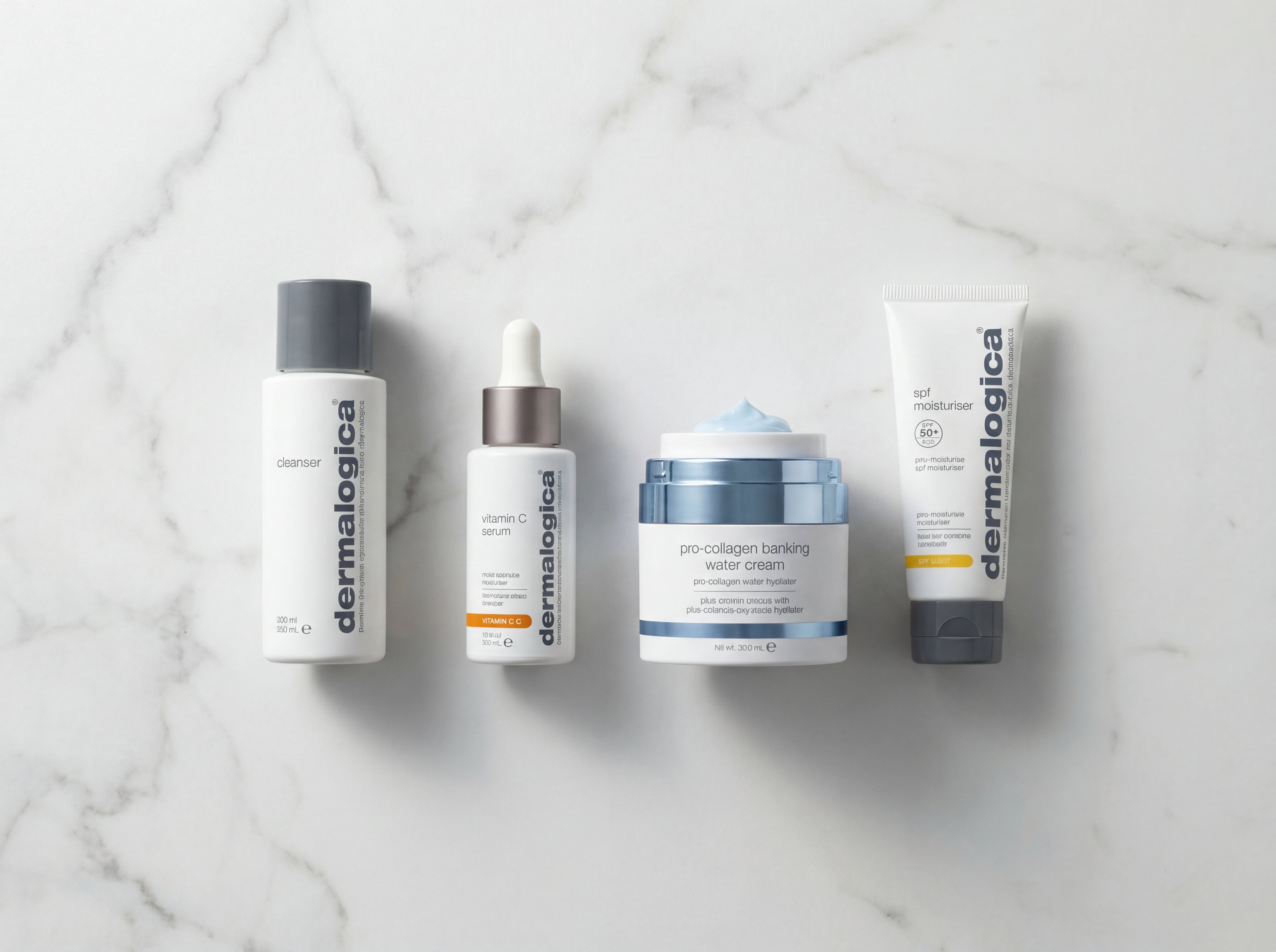 Four Dermalogica products arranged in skincare routine order on white marble: cleanser, serum, water cream, and SPF