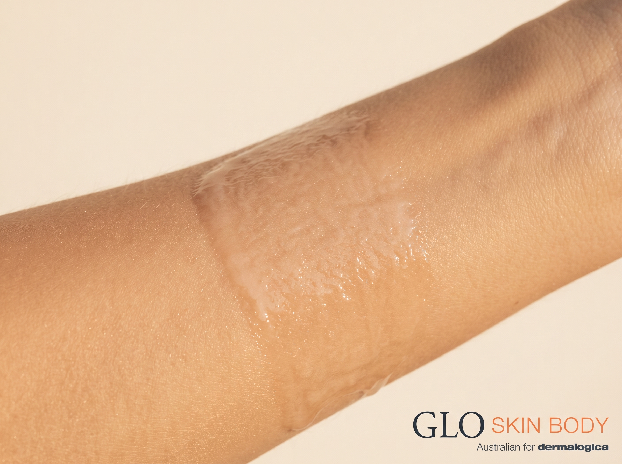 Macro shot of a lightweight serum texture absorbing into skin