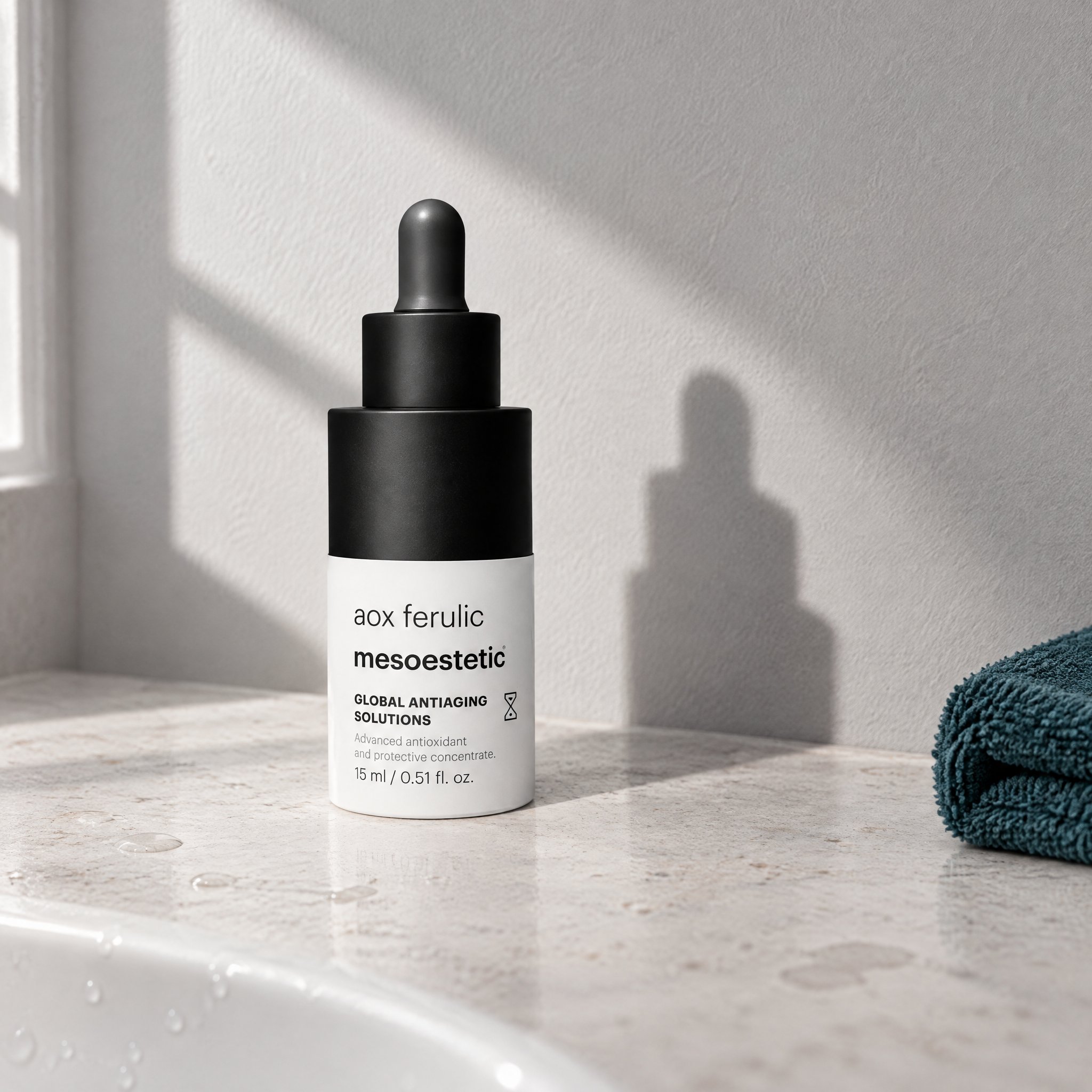 mesoestetic AOX Ferulic antioxidant serum bottle on a neutral background