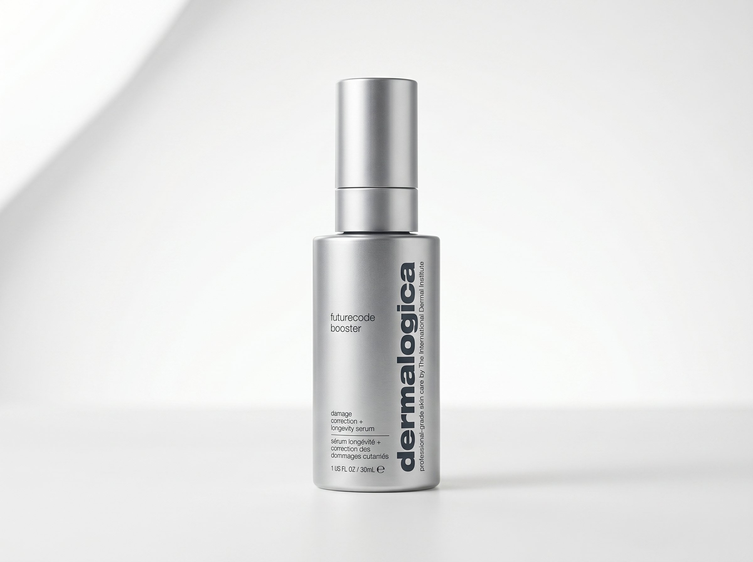 Dermalogica FutureCode Booster serum bottle on a clean white surface under soft diffused studio lighting