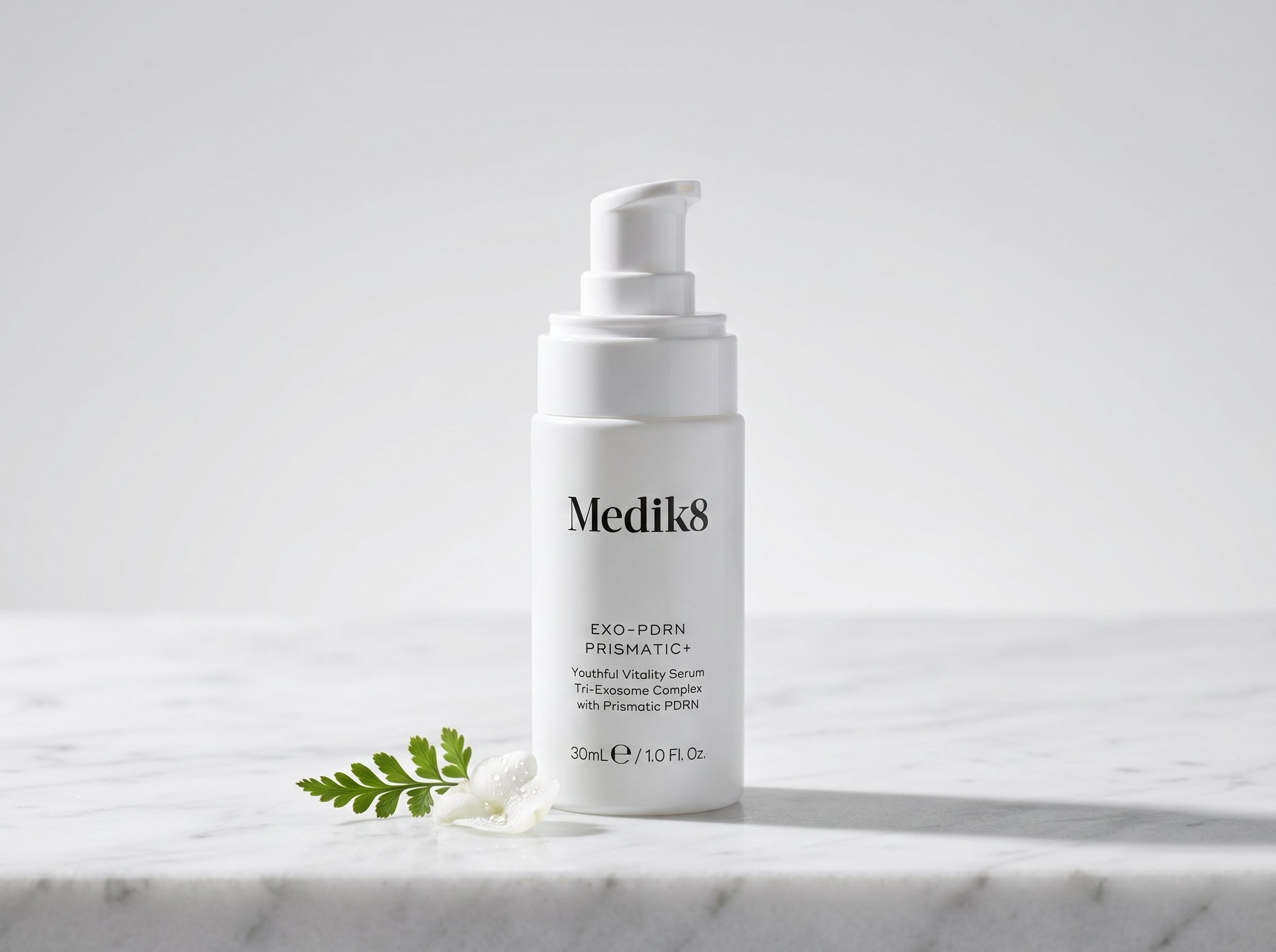 Medik8 Exo-PDRN Prismatic+ serum bottle on marble surface in soft directional light