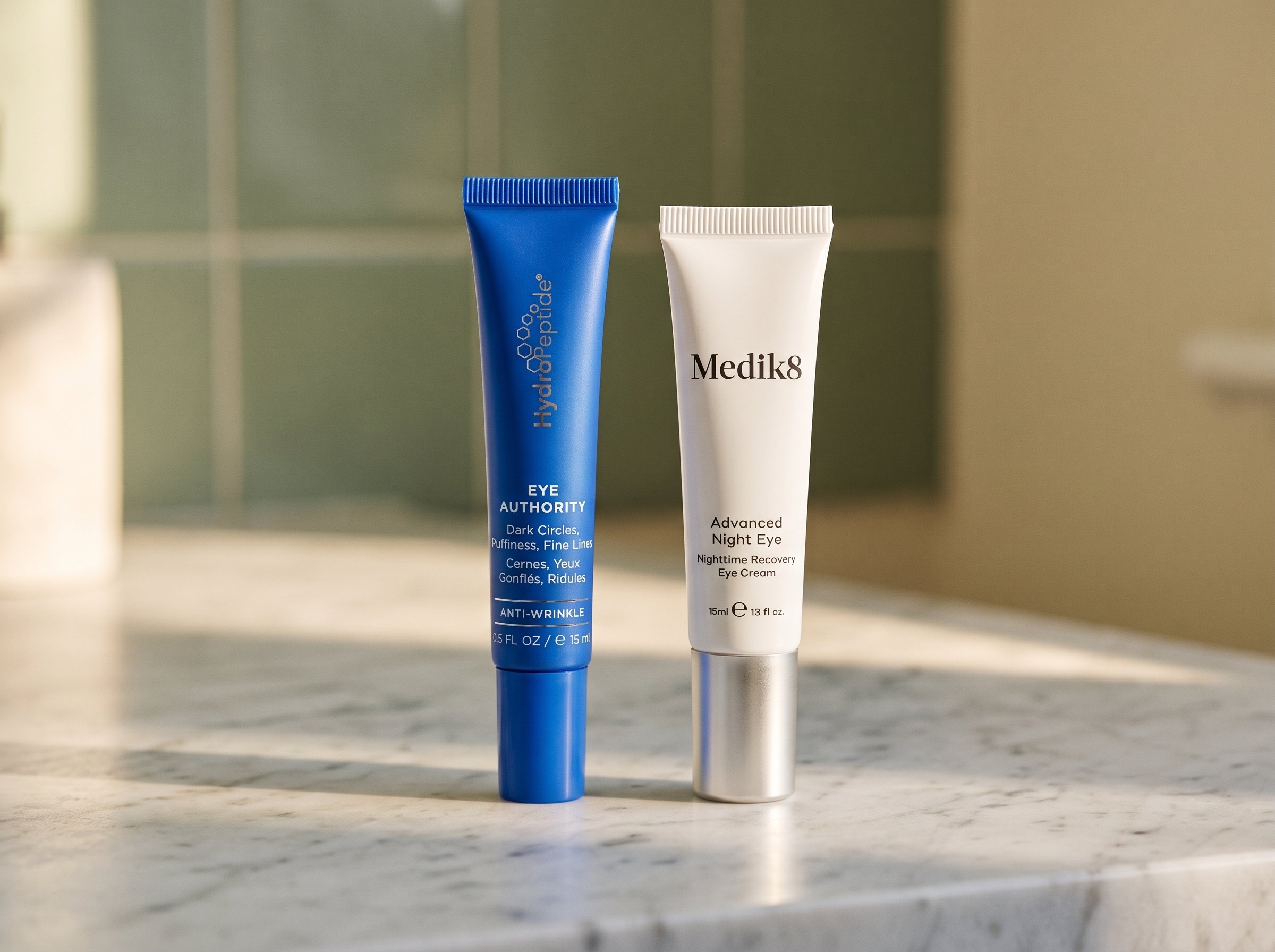 HydroPeptide Eye Authority and Medik8 Advanced Night Eye styled on a counter