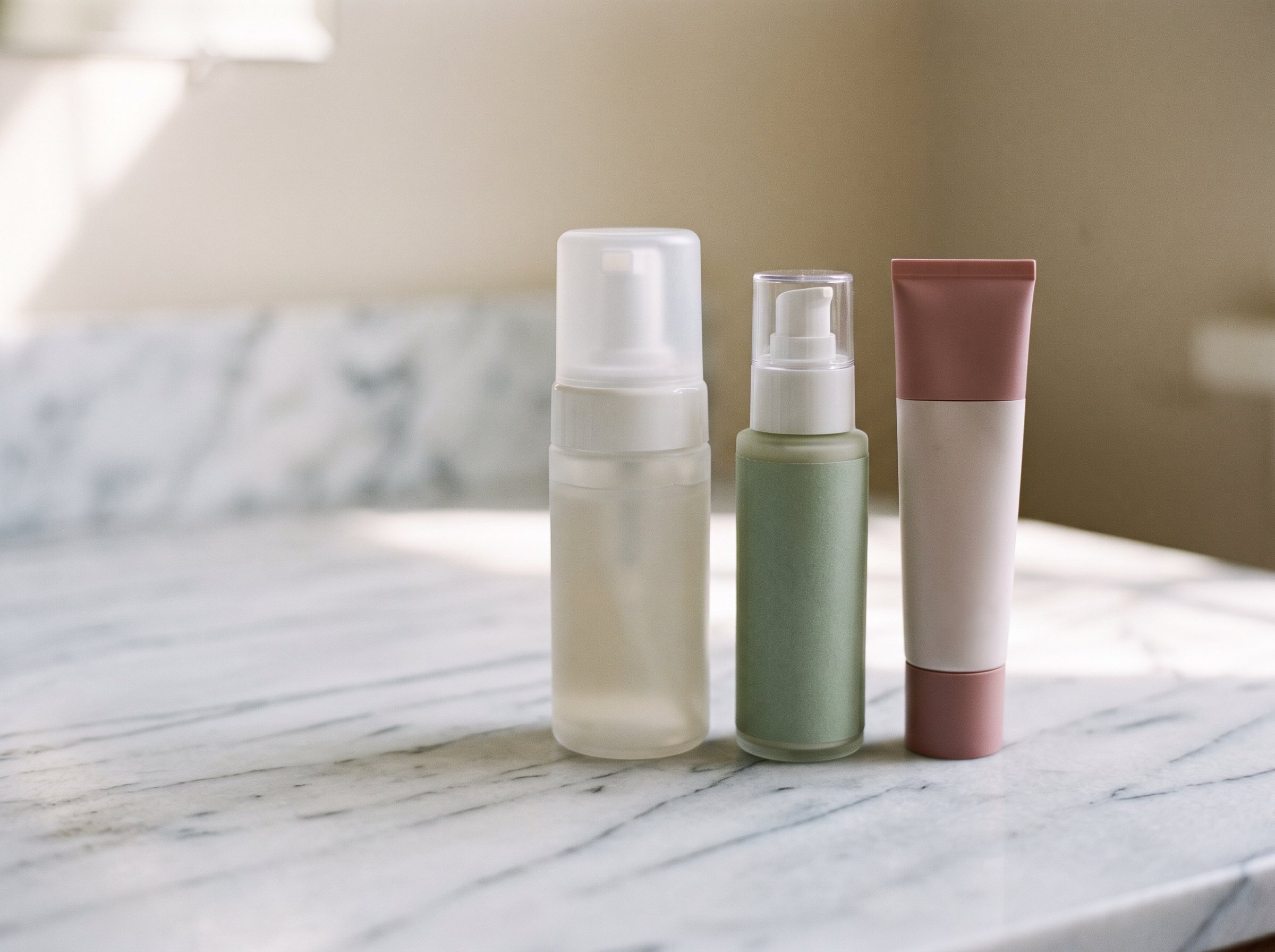 Morning skincare routine products arranged on a bathroom counter
